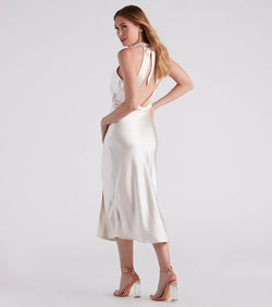 Step into winter chic with the Ingrid Formal Satin Halter Dress, a ivory mini dress featuring an above-the-knee cut ideal for cocktail parties, festive gatherings, or clubwear.