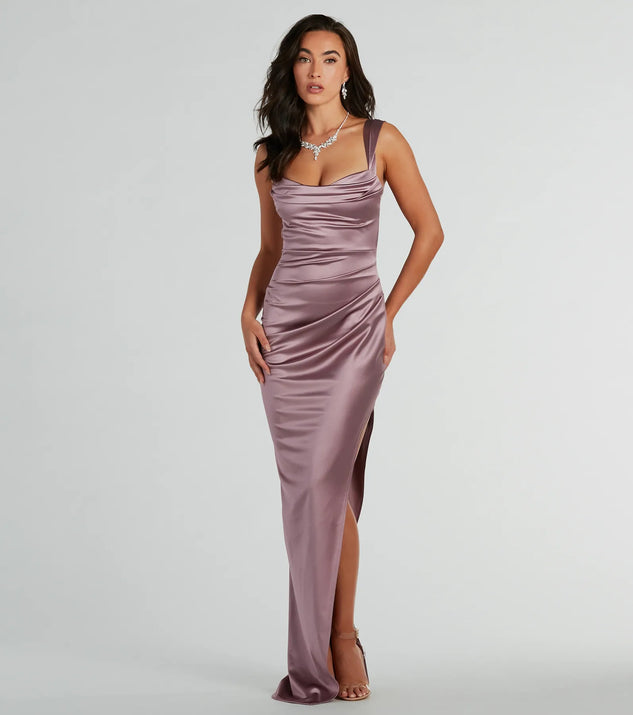 You'll be the best dressed in the Kirsten Satin Cowl Neck High Slit Formal Dress as your summer formal dress with unique details from Windsor.