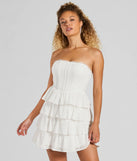 Essential for vacations or summer days, the Sweetest Sight Strapless Ruffled Eyelet Mini Dress is a sundress or milkmaid dress with sleek and flirty details.