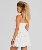 Essential for vacations or summer days, the Sweetest Sight Strapless Ruffled Eyelet Mini Dress is a sundress or milkmaid dress with sleek and flirty details.