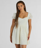 Essential for vacation or concert outfits, the Perfectly Stunning Bow Eyelet Lace Skater Dress is a sundress or milkmaid dress with sleek and flirty details.