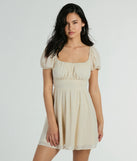 Essential for vacations or summer days, the Flirt And Twirl Puff Sleeve Tie-Back Skater Dress is a sundress or milkmaid dress with sleek and flirty details.