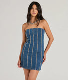 Essential for vacations or summer days, the Tell Me About It Stud Strapless Denim Mini Dress is a sundress or milkmaid dress with sleek and flirty details.