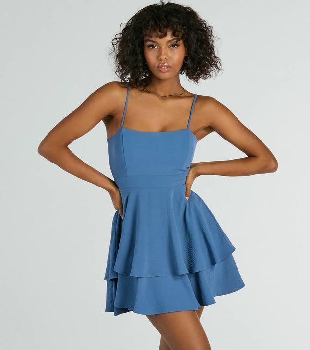 Essential for vacations or summer days, the Divine Cutie Tie Back Ruffled Skater Dress is a sundress or milkmaid dress with sleek and flirty details.