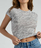 The Refresh Moment Abstract Print Mesh Crop Top is a short-sleeve top that is cool enough for warm weather and provides a stylish layer to create a trendsetting look.