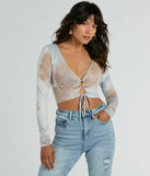 Whether fitted or flowy, the Tie Dye Cutie Lace-Up Long Sleeve Crop Top is a long-sleeve top that offers endless styling options as a layer or a standalone piece to elevate your outfit for the season.