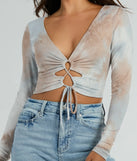 Whether fitted or flowy, the Tie Dye Cutie Lace-Up Long Sleeve Crop Top is a long-sleeve top that offers endless styling options as a layer or a standalone piece to elevate your outfit for the season.