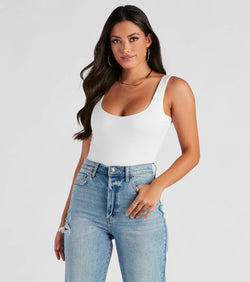 The Staple Piece Scoop Neck Bodysuit in white is a women's workwear essential with an elevated fabric and chic silhouette, ideal for layering and versatile enough to take your look from office chic to going-out ready!