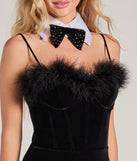 Closeup of of black velvet bodysuit emphasizing the the feather trim and soft velvet texture.