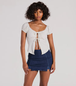 The Sultry Example Tie-Front Lace Trim Crop Top is a short-sleeve top that is cool enough for warm weather and provides a stylish layer to create a trendsetting look.