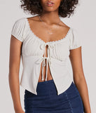 The Sultry Example Tie-Front Lace Trim Crop Top is a short-sleeve top that is cool enough for warm weather and provides a stylish layer to create a trendsetting look.