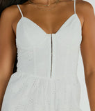 The Sweet Aura Sleeveless Sweetheart Eyelet Romper is an elevated one-piece that blends sleek sophistication with playful charm, perfect for nailing casual or formal outfits.