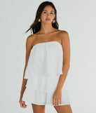 The Poolside Vacay Strapless Ruffled Romper is an elevated one-piece that blends sleek sophistication with playful charm, perfect for nailing casual or formal outfits.