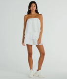 The Poolside Vacay Strapless Ruffled Romper is an elevated one-piece that blends sleek sophistication with playful charm, perfect for nailing casual or formal outfits.