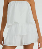 The Poolside Vacay Strapless Ruffled Romper is an elevated one-piece that blends sleek sophistication with playful charm, perfect for nailing casual or formal outfits.