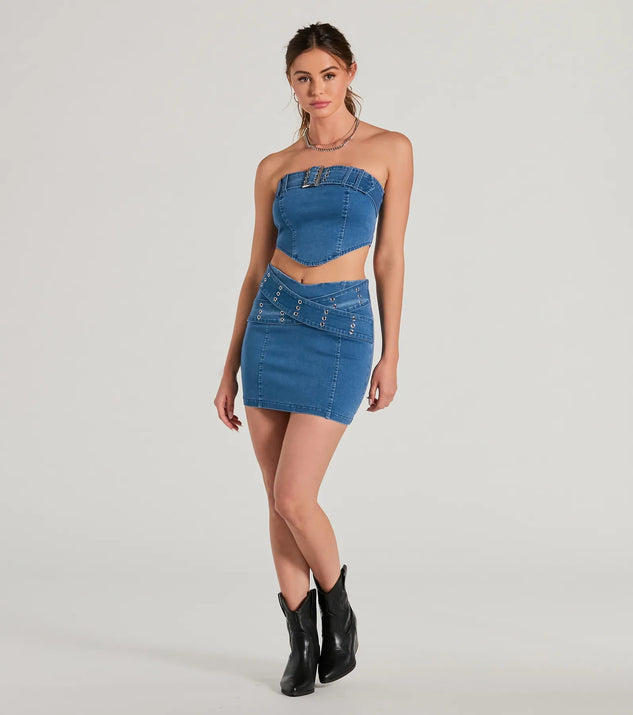 The denim wash and trendy design of the Daily Vibe Cross Belted Denim Mini Skirt is a chic fall piece for any wardrobe, versatile for everyday wear.