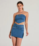 The denim wash and trendy design of the Daily Vibe Cross Belted Denim Mini Skirt is a chic fall piece for any wardrobe, versatile for everyday wear.