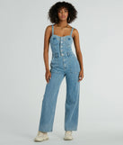 The Trendy Perfection Button Up Wide Leg Denim Jumpsuit is an elevated one-piece that blends sleek sophistication with playful charm, perfect for nailing casual or formal outfits.