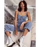 The Trendy Perfection Button Up Wide Leg Denim Jumpsuit is an elevated one-piece that blends sleek sophistication with playful charm, perfect for nailing casual or formal outfits.