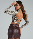 With fun and flirty details, Sassy Brushed Knit Snake Crop Top shows off your unique style for a trendy outfit for the summer season!