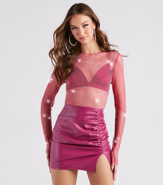 Whether fitted or flowy, the Glitzy Muse Rhinestone Fishnet Crop Top is a long-sleeve top that offers endless styling options as a layer or a standalone piece to elevate your outfit for the season.