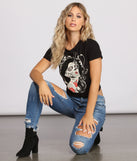 Night of the Spirited Skeleton Short Sleeve Graphic Tee styled with Women's Distressed Jeans and Black Ankle Booties