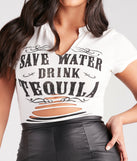 The Save Water Drink Tequila Graphic Crop Tee is a short-sleeve top that is cool enough for warm weather and provides a stylish layer to create a trendsetting look.